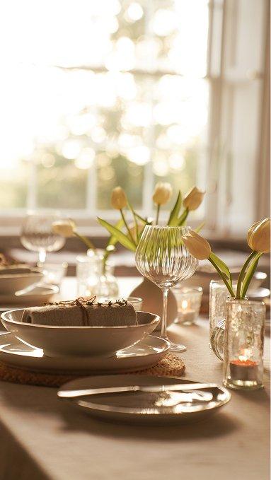 a table setting with a napkin, place setting, and a fork